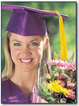 A young person in cap and gown graduating from college