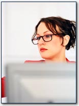 Photo of someone working at a computer 